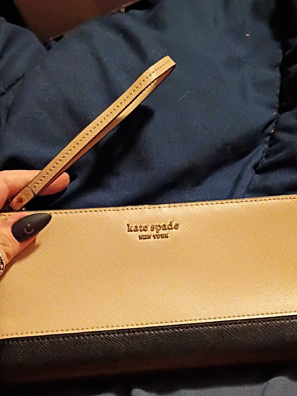 kate spade two-tone wristlet in Cream and black with gold logo
